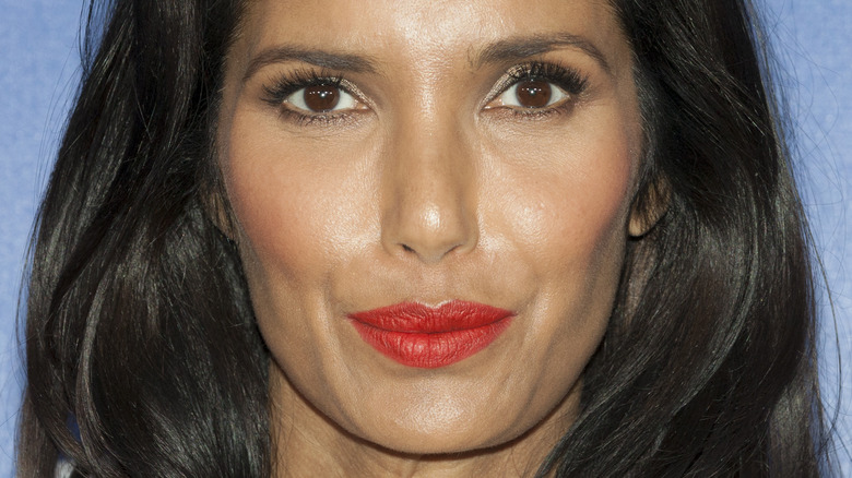 Padma Lakshmi with red lipstick and slight smile