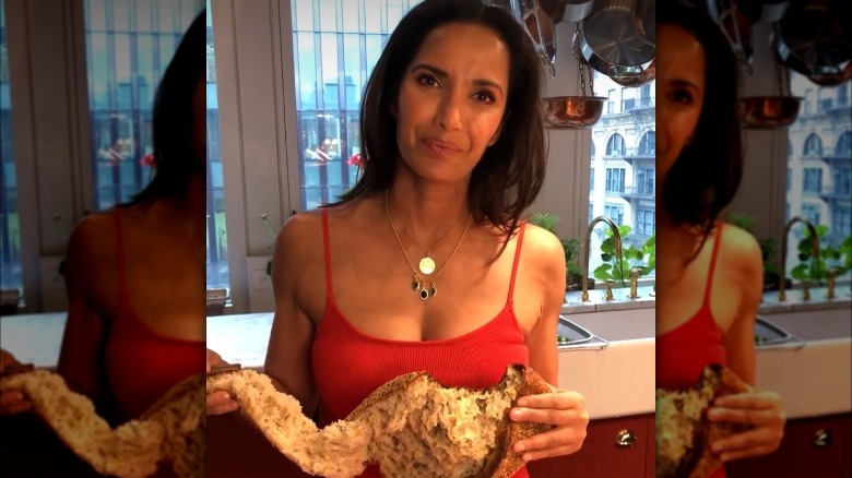Padma Lakshmi holding torn bread