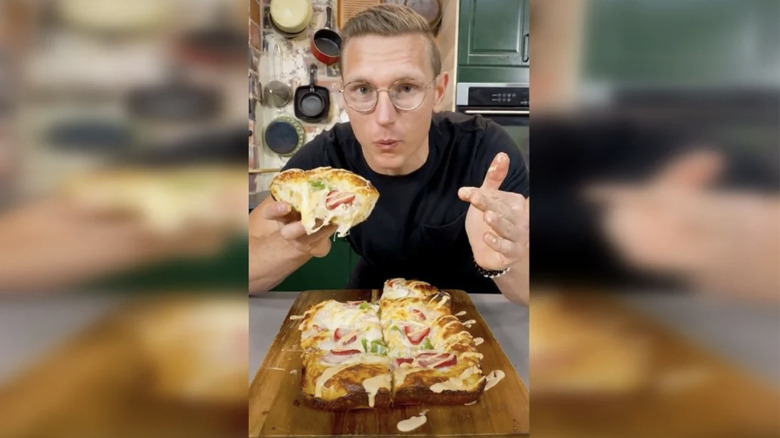 Josh Scherer eating pizza