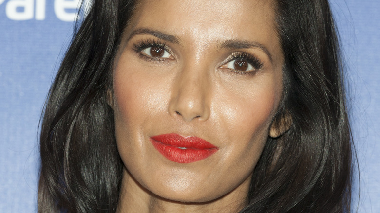 Closeup of Padma Lakshmi wearing red lipstick