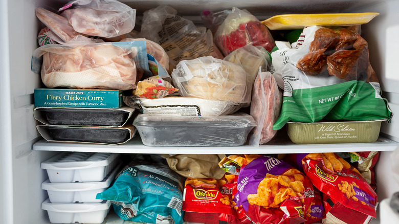 Inside freezer stacked with food