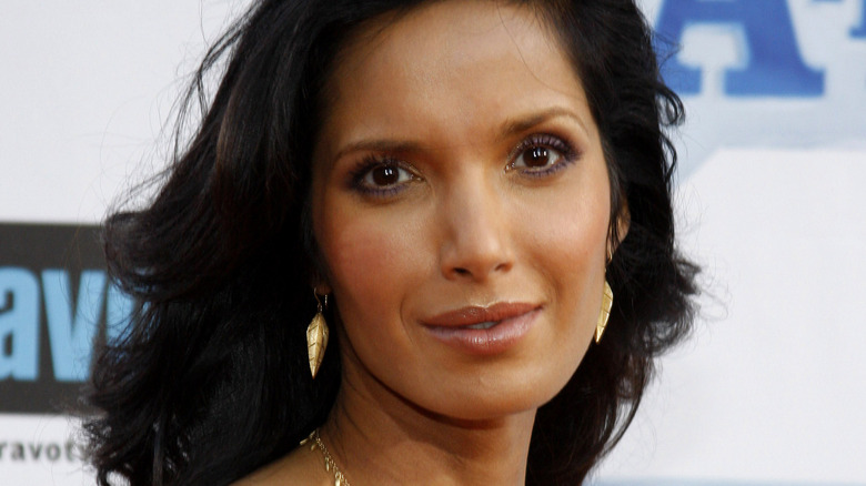 Padma Lakshmi wearing gold earrings