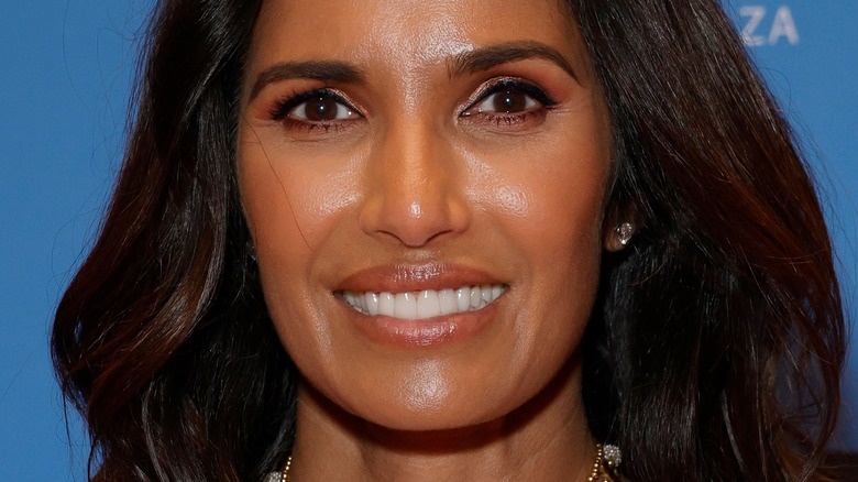 Padma Lakshmi with hair down and wide smile