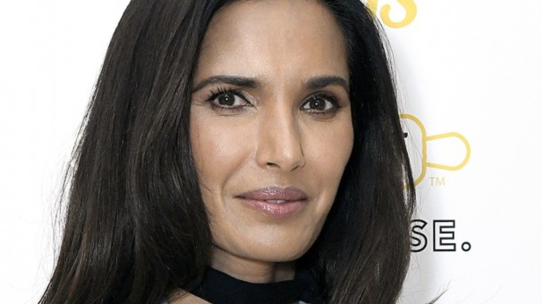 Padma Lakshmi smiles in black