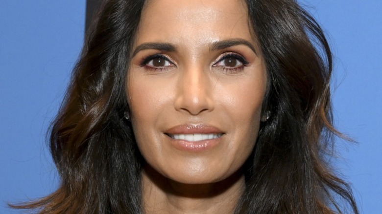 Padma Lakshmi with hair down and wide smile