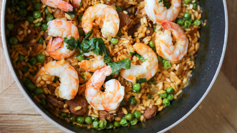 paella with shrimp in metal pot