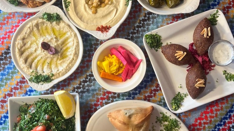 A spread of dips, sambousek, and falafel at Brooklyn restaurant Tanoreen