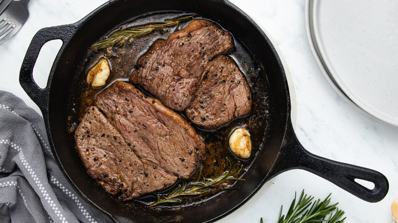 garlic steak in cast-iron skillet