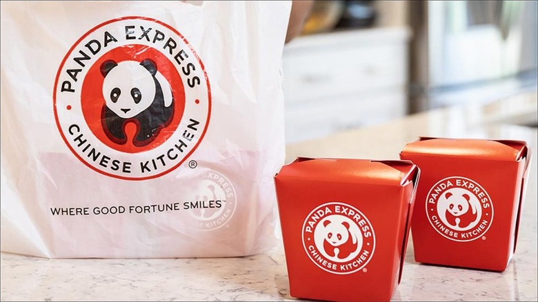 panda express plastic takeout bag and two red takeout containers