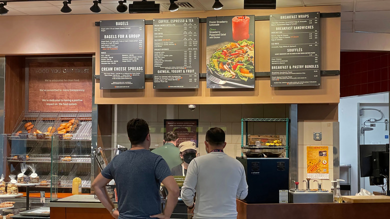 two people ordering at a Panera counter