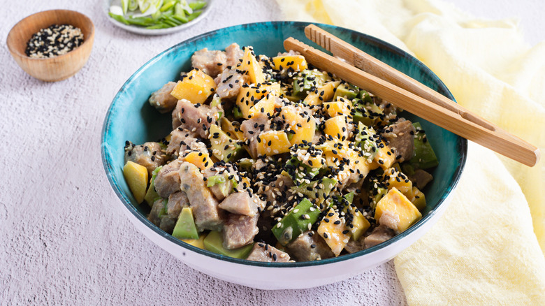 tuna poke bowl with chopsticks