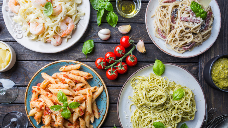 Plates of pasta with various sauces