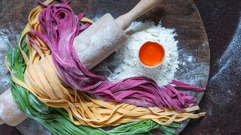 colorful pasta with rolling pin