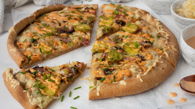 sliced pastrami reuben pizza