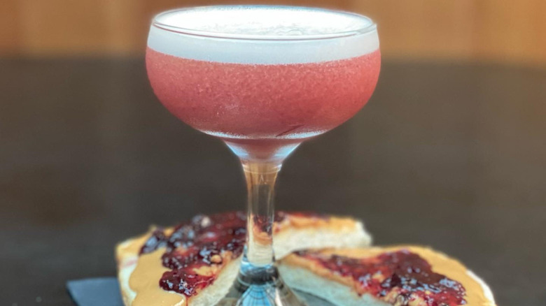 Pink cocktail with PB&J sandwich