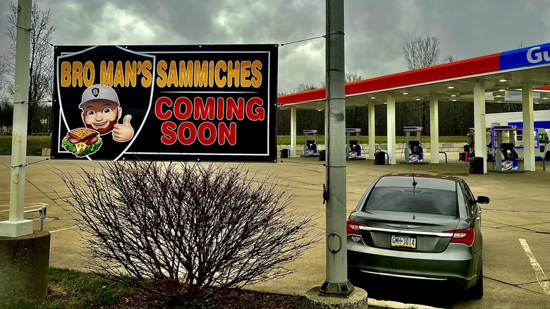 Restaurant sign outside of a gas station