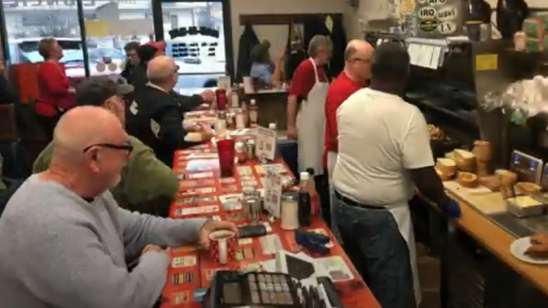 diners at the counter of Gab N Eat