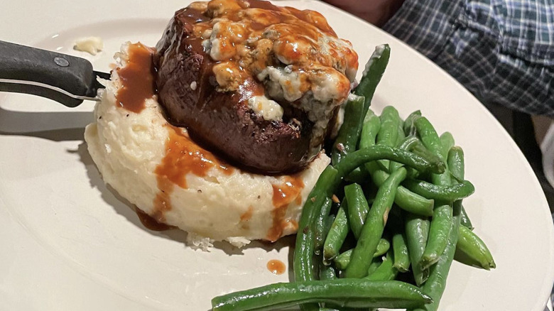Blue cheese topped filet with potatoes and green beans
