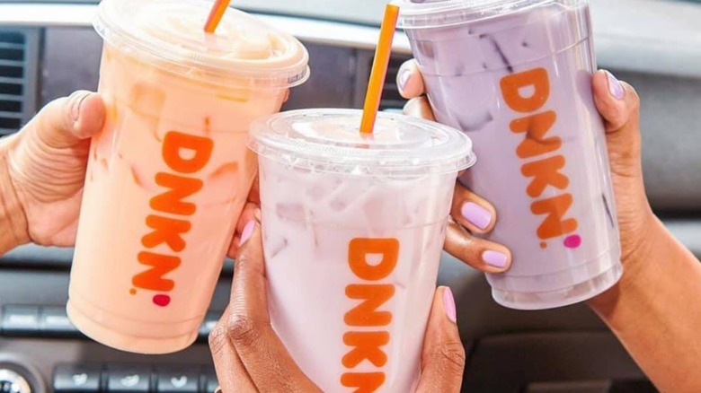 People holding Dunkin refreshers
