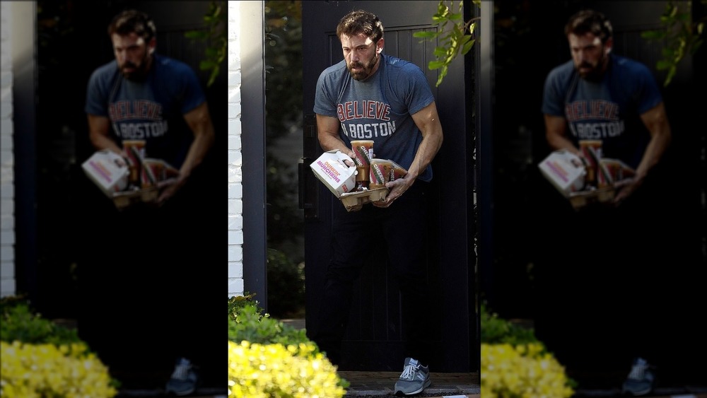 Ben Affleck juggling Dunkin' items