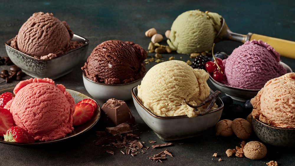 Scoops of ice cream in bowls with garnishes