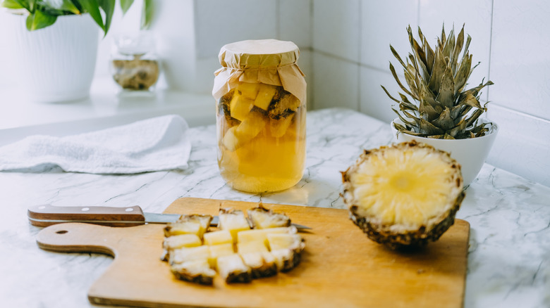 Pineapple cut up on a counter. 