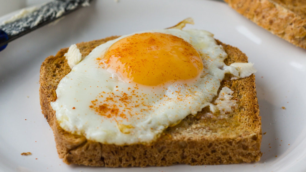 Sunnyside-up egg on toast