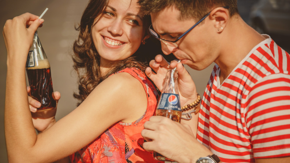 Couple drinking Pepsi