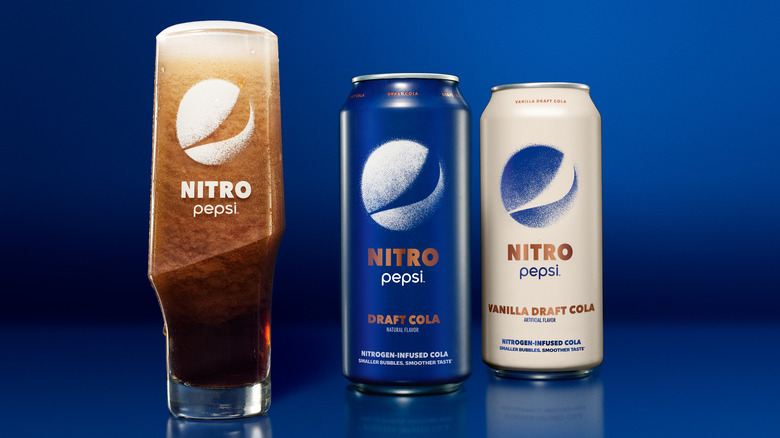 Nitro Pepsi cans on blue background 