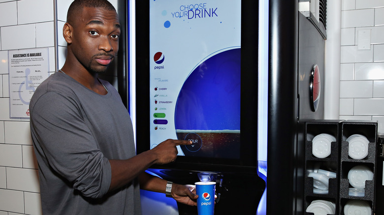 man using a Pepsi Spire machine 
