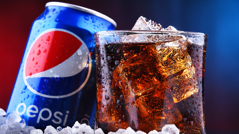 A Pepsi can and glass