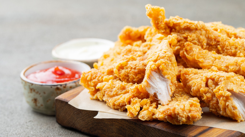 breaded chicken strips with two dipping sauces