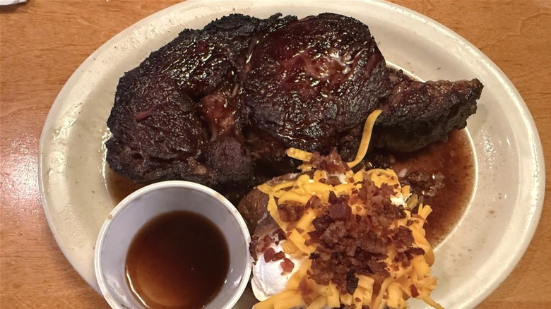 Pittsburgh-style steak at Texas Roadhouse with loaded baked potato