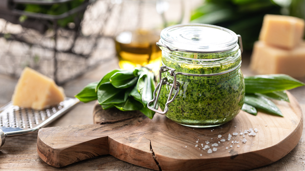 Pesto in a mason jar on a board