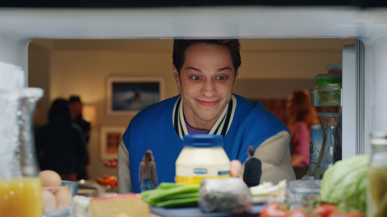 Man looking in fridge