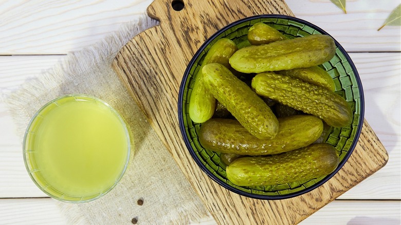 pickles in a jar beside pickle juice