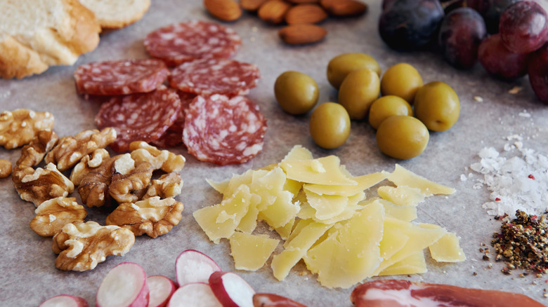 Charcuterie board with walnuts 