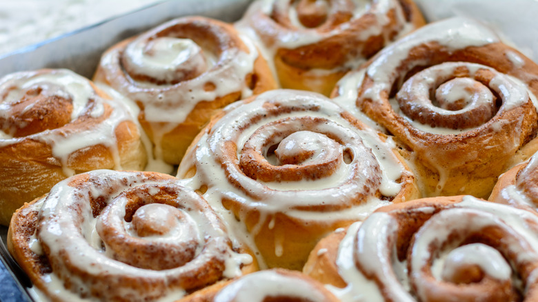 pan of iced cinnamon rolls