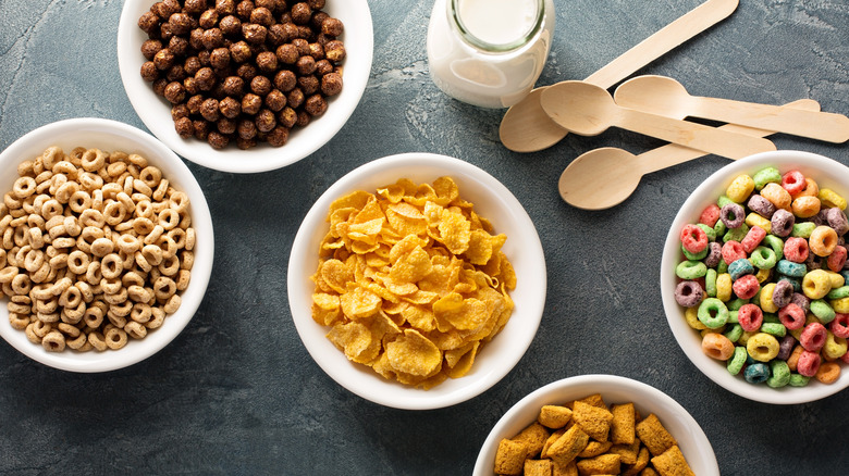 variety of kids breakfast cereals in bowls
