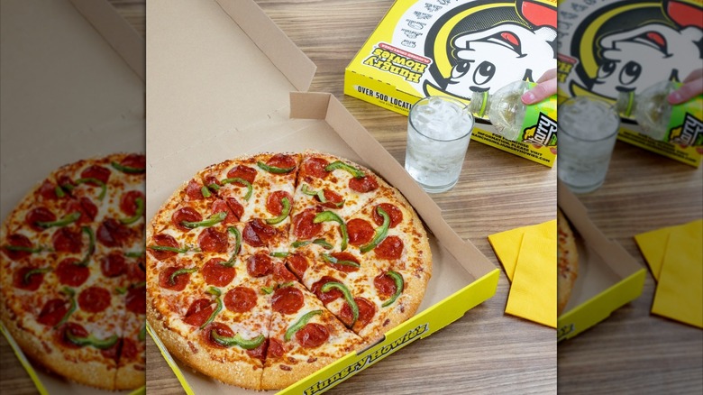 Hungry Howie's pepperoni and green bell pepper pizza in box.