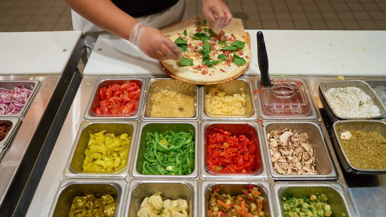 Pizza being made at Blaze Pizza