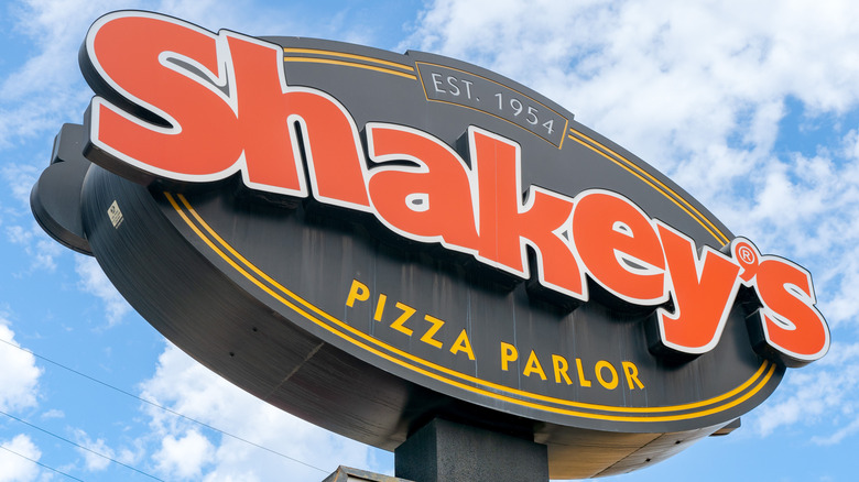 Shakey's Pizza Parlor sign against sky