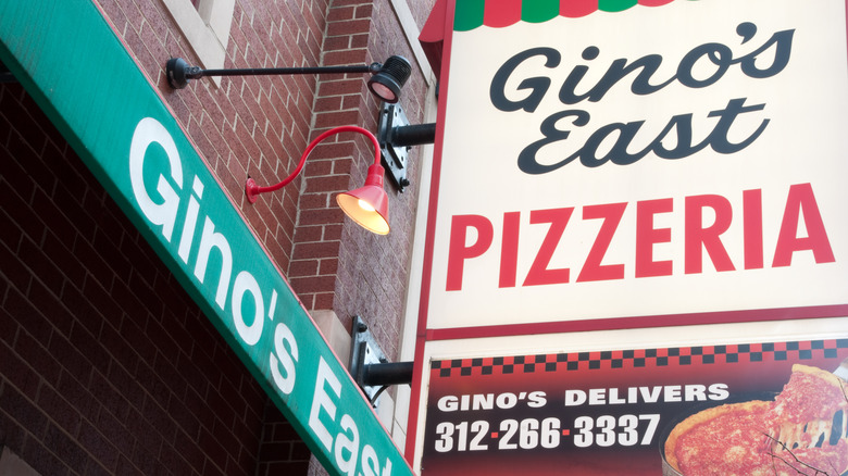 Outdoor signages of a Gino's East pizza place