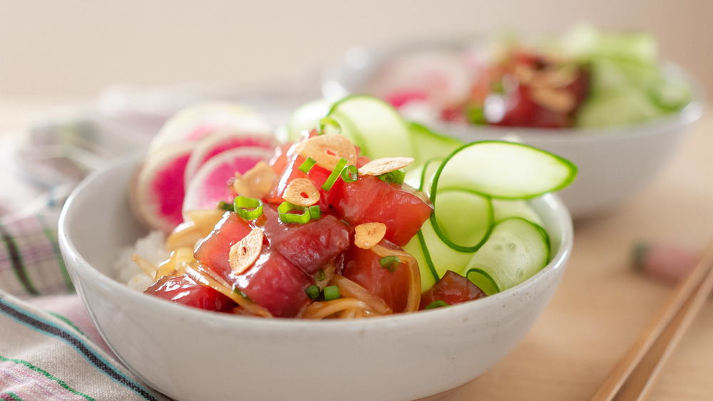 poke bowl ingredients in white bowl