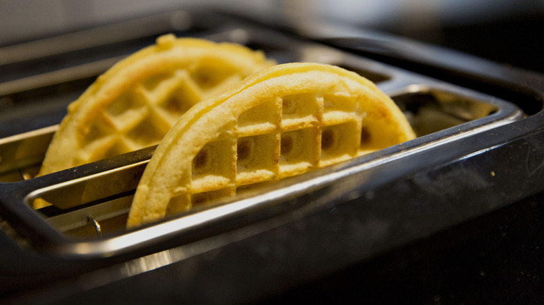 Frozen golden waffles in toaster