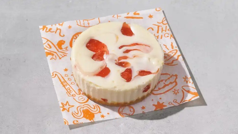 Popeyes' strawberry cheesecake cup on napkin