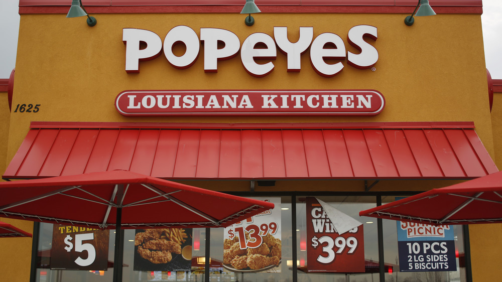 Popeyes storefront with ads