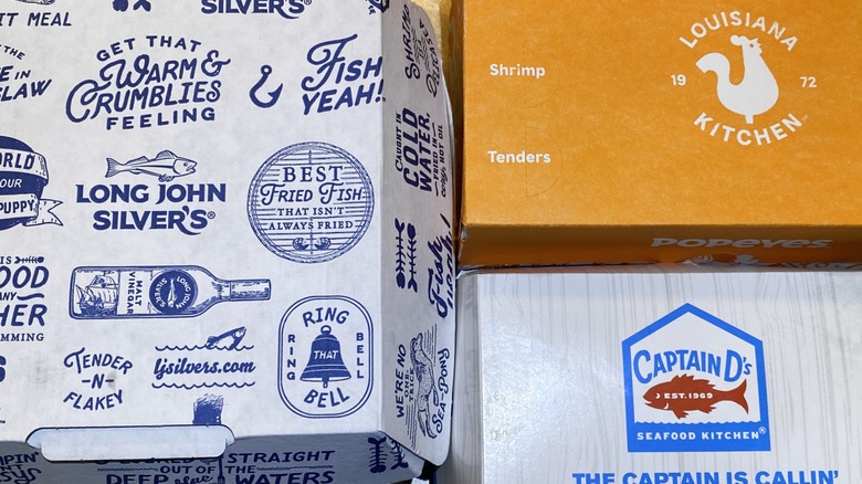 Long John SIlver's, Popeyes, and Captain D's takeout boxes side by side