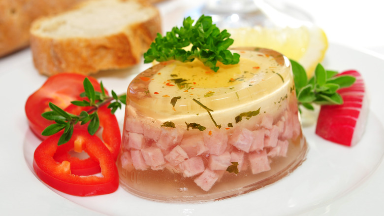 Meat and vegetable aspic garnished with parsley