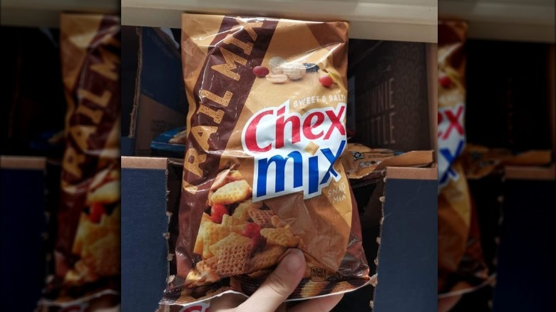 Someone Holding Chex Mix Trail Mix Bag